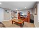 Relaxing basement area with a carpeted floor, a TV with built-in cabinet, and a comfortable seating arrangement at 5706 S Garland Way, Littleton, CO 80123