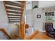 Bright foyer with staircase and elegant tile leading to the front door at 5706 S Garland Way, Littleton, CO 80123