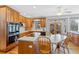 Beautiful kitchen featuring an island, stainless steel appliances, and wood cabinets at 5706 S Garland Way, Littleton, CO 80123