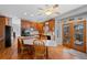 Well-appointed kitchen with wood cabinets, island cooktop, and breakfast table at 5706 S Garland Way, Littleton, CO 80123