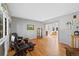 Spacious living room featuring hardwood floors and an open archway to adjacent room at 5706 S Garland Way, Littleton, CO 80123