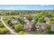 Expansive aerial view showcasing the property's location near a walking path and open space at 22302 Quail Run Way, Parker, CO 80138