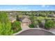 Aerial view of a home and its surrounding neighborhood, showcasing landscaping and community at 22302 Quail Run Way, Parker, CO 80138