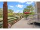 Secluded back patio with ample space for outdoor dining and entertaining with views of a walking path at 22302 Quail Run Way, Parker, CO 80138