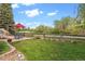 Serene backyard with lush lawn and patio area, ideal for outdoor living and enjoying nature at 22302 Quail Run Way, Parker, CO 80138
