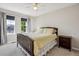 Inviting bedroom with a bed, nightstand, and windows offering neighborhood views at 22302 Quail Run Way, Parker, CO 80138