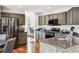 Modern kitchen featuring stainless steel appliances, granite countertops, and wood floors at 22302 Quail Run Way, Parker, CO 80138