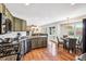 Beautiful kitchen and breakfast nook boasts hardwood floors and stainless steel appliances at 22302 Quail Run Way, Parker, CO 80138