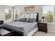 Comfortable main bedroom featuring a large bed, accent pillows, and serene decor at 22302 Quail Run Way, Parker, CO 80138