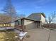Gray two-story home with attached garage and landscaping at 4974 E 124Th Way, Thornton, CO 80241