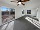 Bright living room featuring sliding glass doors to backyard at 4974 E 124Th Way, Thornton, CO 80241
