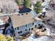 Aerial view of house, yard, and solar panels at 6148 W Pacific Cir, Lakewood, CO 80227