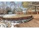 Landscaped yard with retaining wall and shed at 6148 W Pacific Cir, Lakewood, CO 80227