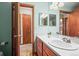 Simple bathroom with single vanity and access to additional rooms at 6148 W Pacific Cir, Lakewood, CO 80227