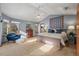 Main bedroom with vaulted ceiling, carpeted floors, and a ceiling fan at 6148 W Pacific Cir, Lakewood, CO 80227