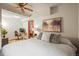 Basement bedroom with a queen bed, ceiling fan, and a workspace at 6148 W Pacific Cir, Lakewood, CO 80227