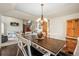 Bright dining room with hardwood floors and a view to the kitchen and living areas at 6148 W Pacific Cir, Lakewood, CO 80227