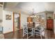 Charming dining room with hardwood floors and a view to the living room at 6148 W Pacific Cir, Lakewood, CO 80227