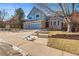 Beautiful two-story home featuring a brick facade, a two-car garage, and well-maintained landscaping at 6148 W Pacific Cir, Lakewood, CO 80227