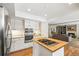 Modern kitchen with stainless steel appliances and a kitchen island at 6148 W Pacific Cir, Lakewood, CO 80227