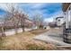 A spacious backyard with wood fence, and a concrete patio offer great space for outdoor living at 6313 E 130Th Ave, Thornton, CO 80602