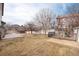 Large, grassy backyard is fully fenced, with a concrete patio, making it perfect for outdoor activities at 6313 E 130Th Ave, Thornton, CO 80602