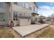 A spacious backyard features a concrete patio and access to the home, ideal for entertaining at 6313 E 130Th Ave, Thornton, CO 80602