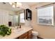 Bright bathroom features natural light, a glass enclosed shower, and modern fixtures at 6313 E 130Th Ave, Thornton, CO 80602