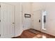 Bright entryway with hardwood floors, a coat closet, and natural light at 6313 E 130Th Ave, Thornton, CO 80602