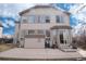 The back of the home features large windows and a spacious patio, perfect for outdoor living and entertaining at 6313 E 130Th Ave, Thornton, CO 80602