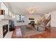 Cozy living room featuring fireplace, comfortable seating, and ample natural light at 6313 E 130Th Ave, Thornton, CO 80602