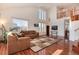 Spacious living room featuring hardwood floors, natural light, and comfortable seating at 6313 E 130Th Ave, Thornton, CO 80602