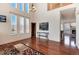 Open-concept living room featuring hardwood floors and vaulted ceiling at 6313 E 130Th Ave, Thornton, CO 80602