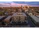 Aerial view of the modern condo building surrounded by a vibrant neighborhood at 1300 N Ogden St # 304, Denver, CO 80218