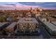 Scenic aerial view of a contemporary apartment building with private balconies, highlighting its prime city location at dusk at 1300 N Ogden St # 304, Denver, CO 80218
