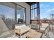 Cozy condo balcony with seating and neighborhood views at 1300 N Ogden St # 304, Denver, CO 80218