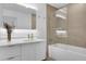 Bright bathroom with a combined tub and shower with a glass enclosure at 1300 N Ogden St # 304, Denver, CO 80218