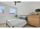 Bright bedroom with large windows, ceiling fan and modern furnishings at 1300 N Ogden St # 304, Denver, CO 80218