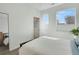 Bright bedroom featuring ensuite bath, two windows and ample natural light at 1300 N Ogden St # 304, Denver, CO 80218