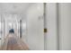 Hallway with unit number, hardwood floors and access to rooms at 1300 N Ogden St # 304, Denver, CO 80218