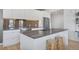 Modern kitchen with stainless steel appliances, sleek countertops, and an island with seating at 1300 N Ogden St # 304, Denver, CO 80218