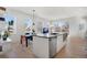 Contemporary kitchen with an island, stainless steel dishwasher, and plenty of counter space at 1300 N Ogden St # 304, Denver, CO 80218