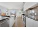 Stylish kitchen with stainless steel appliances and seamless access to the balcony at 1300 N Ogden St # 304, Denver, CO 80218