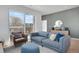 Comfortable living room with stylish decor and access to a balcony at 1300 N Ogden St # 304, Denver, CO 80218