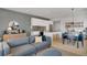 This modern living room features an open floor plan with a sleek kitchen and dining area, and comfortable seating at 1300 N Ogden St # 304, Denver, CO 80218