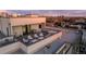 Modern condo rooftop deck with seating, grill, and scenic neighborhood views at 1300 N Ogden St # 304, Denver, CO 80218