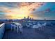 Stylish rooftop deck with comfortable seating and expansive city skyline views at 1300 N Ogden St # 304, Denver, CO 80218