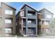 Modern townhome showcasing vertical elements, stylish color blocking and private balconies at 1593 W 166Th Ave, Broomfield, CO 80023