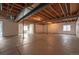 Unfinished basement with concrete floor, visible ceiling and duct work, and insulated walls and window at 1358 14Th Ave, Longmont, CO 80501