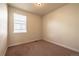 Simple bedroom design with neutral carpet, base molding, and a single window at 1358 14Th Ave, Longmont, CO 80501